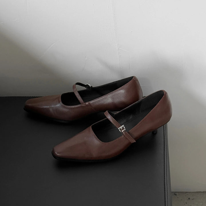 Brown leather kitten heel pumps with ankle strap and buckle detail