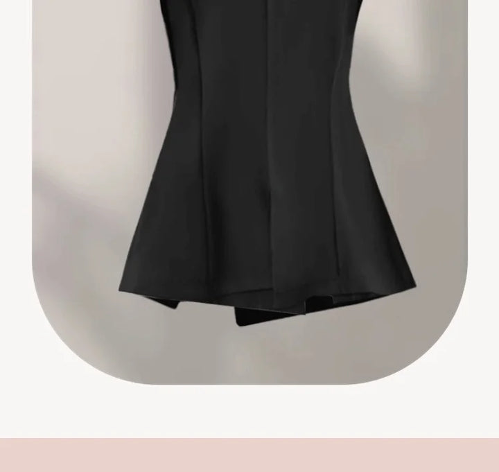 Black sleeveless blazer vest back view with center seam and flared hem