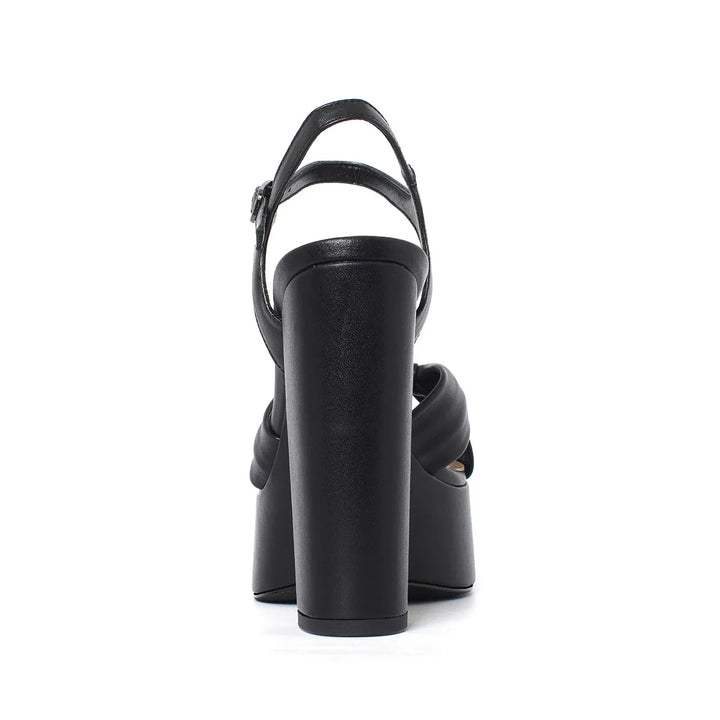 Black platform heel sandal with T-strap and buckle detail, chunky block heel
