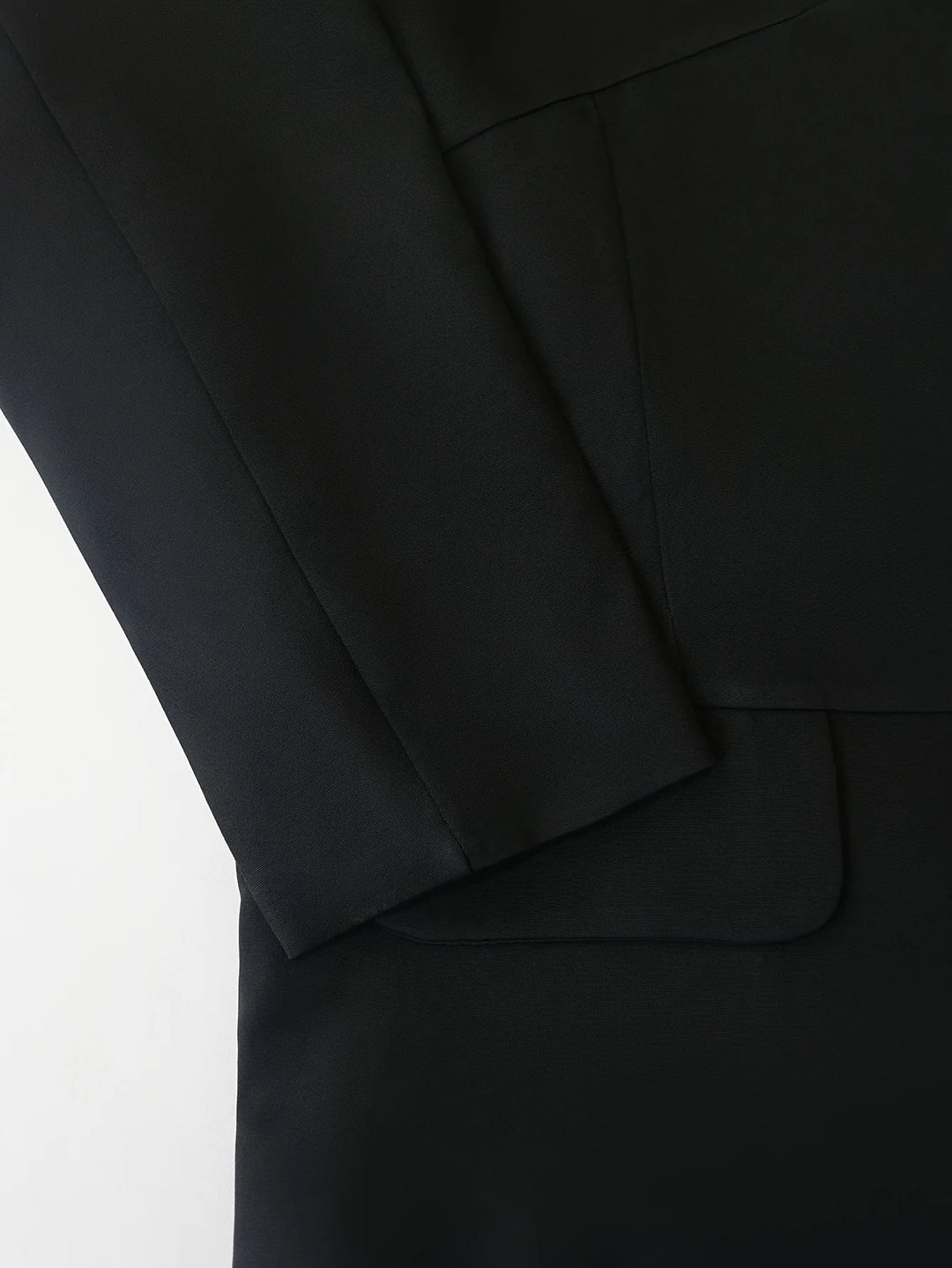 Women’s black slim-fit blazer with lapel and front opening, tailored seam detail