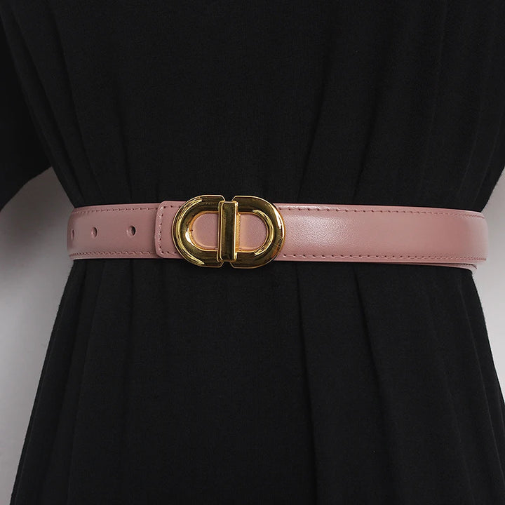 Pink narrow leather waist belt with gold-tone double D buckle and perforated adjustment holes