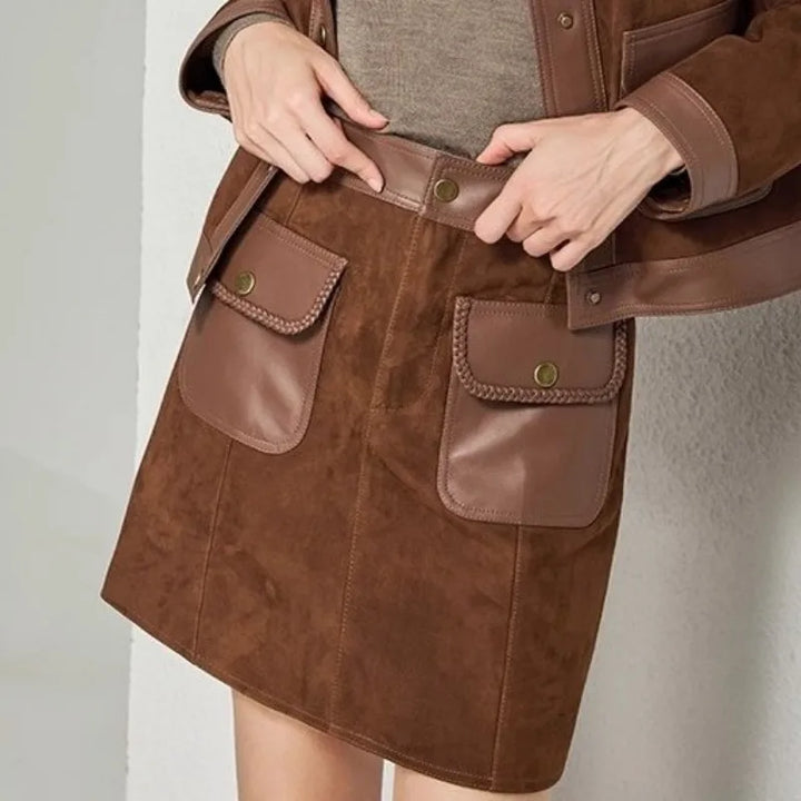 Brown suede jacket detail with front patch pockets and waist belt.