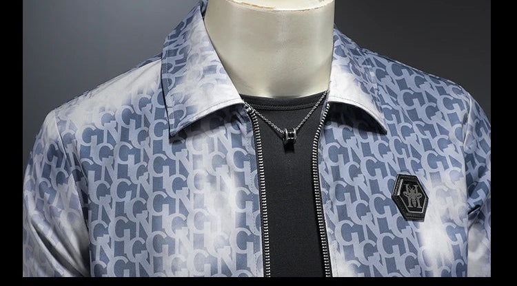 Blue letter jacquard zip jacket with metal chest badge and stand collar