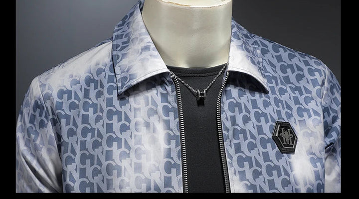 Blue letter jacquard zip jacket with metal chest badge and stand collar