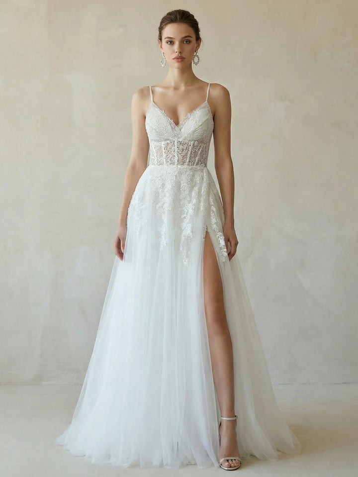 White bridal dress with lace beaded bodice, spaghetti straps, and illusion V-neck with slit skirt