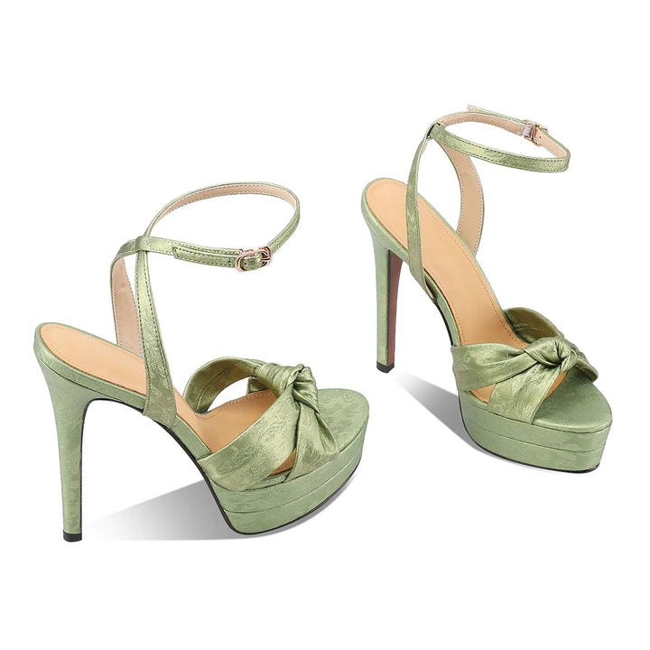 Green leather high-heel platform sandals with ankle buckle and knotted toe strap