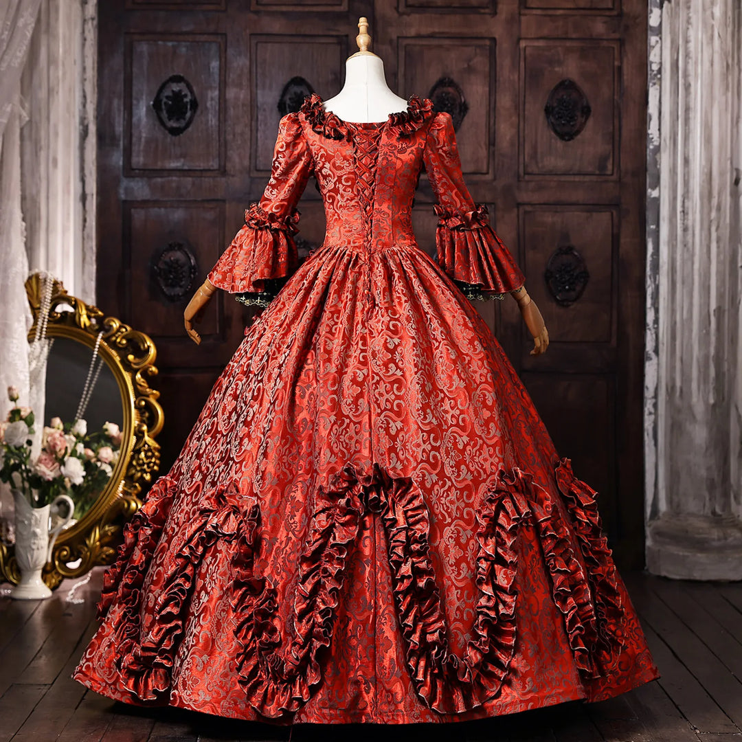 Wine red jacquard ball gown with voluminous layered skirt and gathered bodice