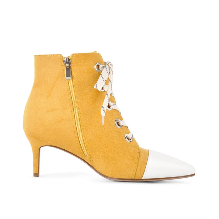 Yellow faux suede ankle boot side view with front laces, zipper, and pointed toe