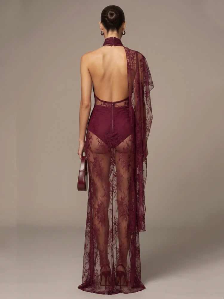Burgundy sheer lace maxi gown, back view with open lace back and long draped overlay.