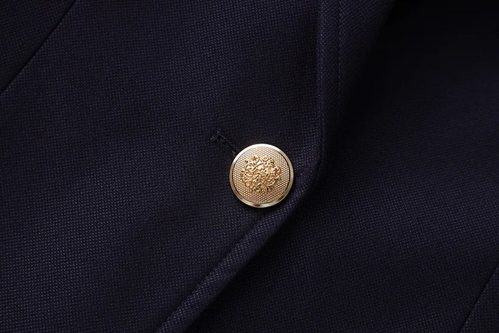 Navy blazer front with round gold button at notched lapel