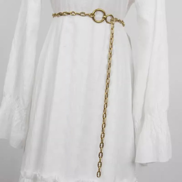 Gold metal chain waist belt with circular ring clasp and long dangling chain