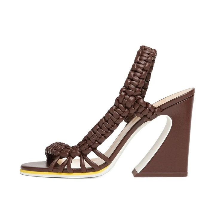 Brown woven high-heel mule sandals with wide crisscross straps and wedge heel
