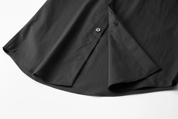 Black men’s slim-fit shirt side view with button placket and short fold-over collar