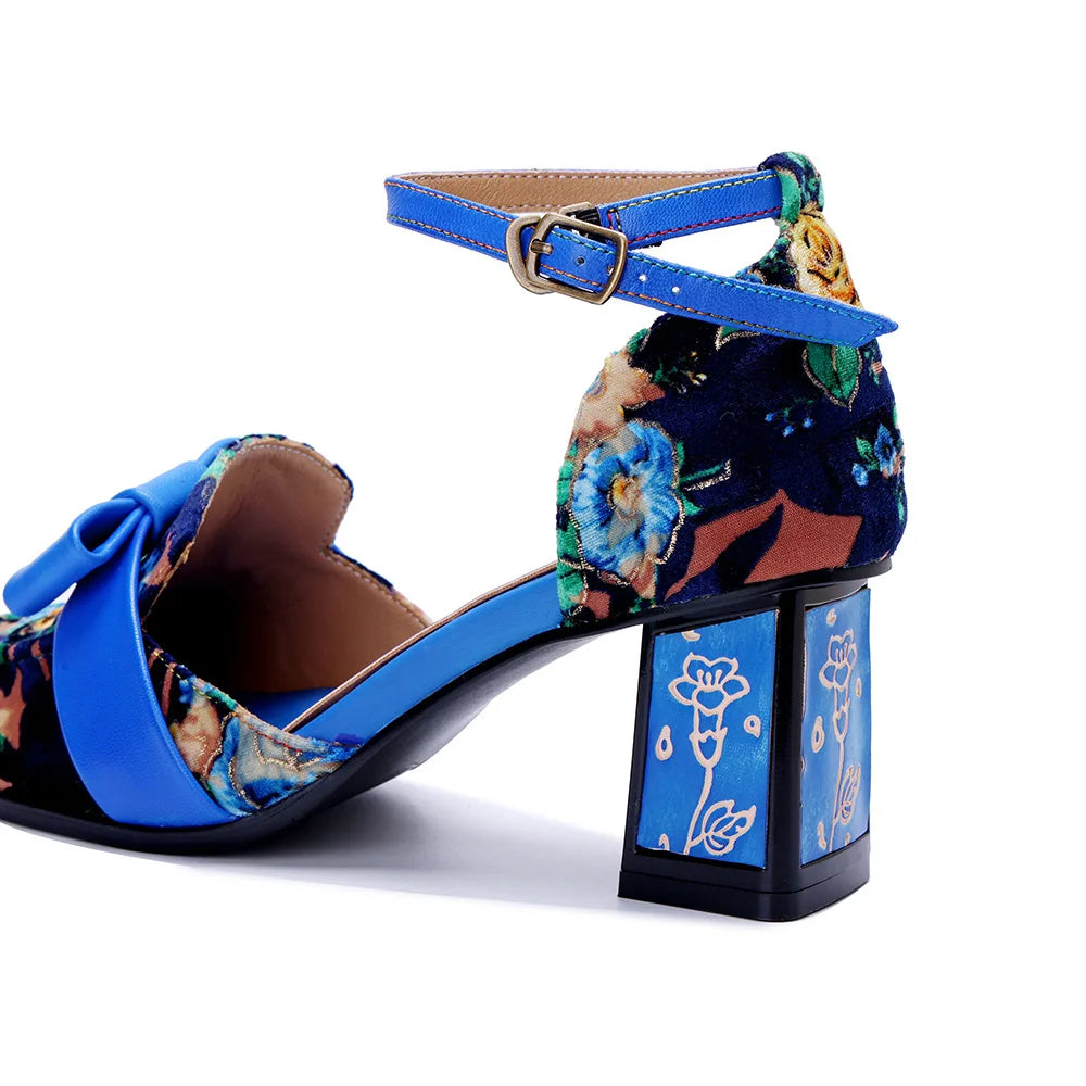 Side view of blue floral high-heel sandal with ankle buckle strap and block heel