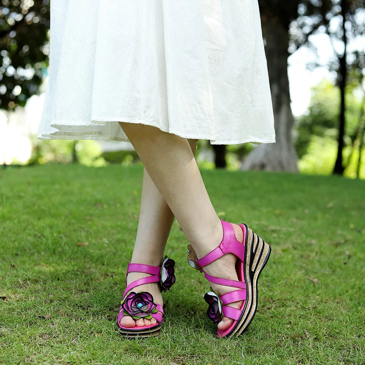 Rosy red sandals with rose floral straps and textured wedge platform sole