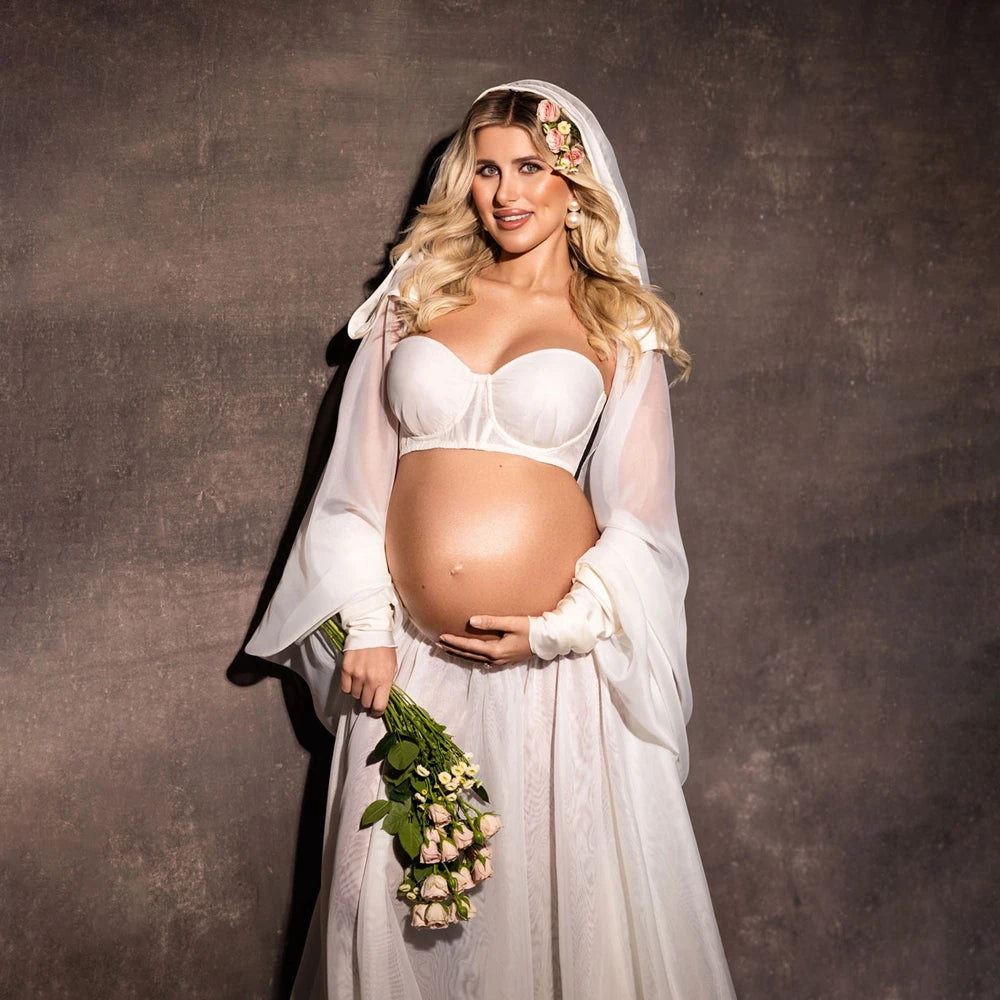 Women’s white maternity robe dress with veiled hood and ruffle-trimmed hem