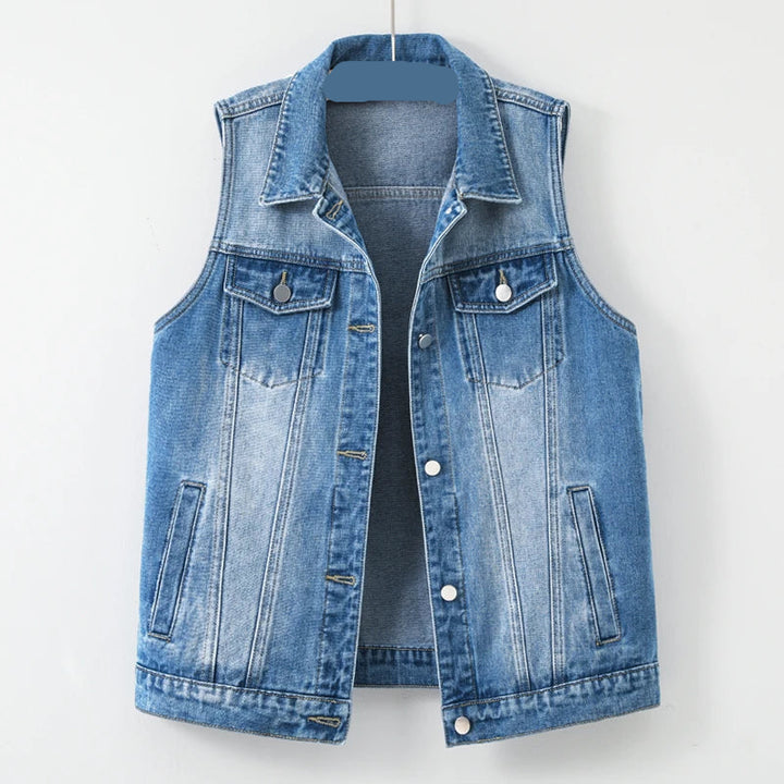 Blue denim vest on a white background