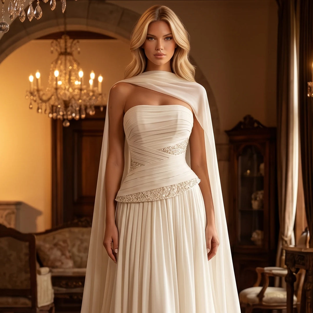 Ivory strapless chiffon bridal gown with sweetheart neckline and beaded waist detail
