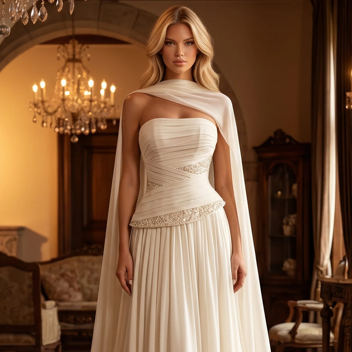 Ivory strapless chiffon bridal gown with sweetheart neckline and beaded waist detail