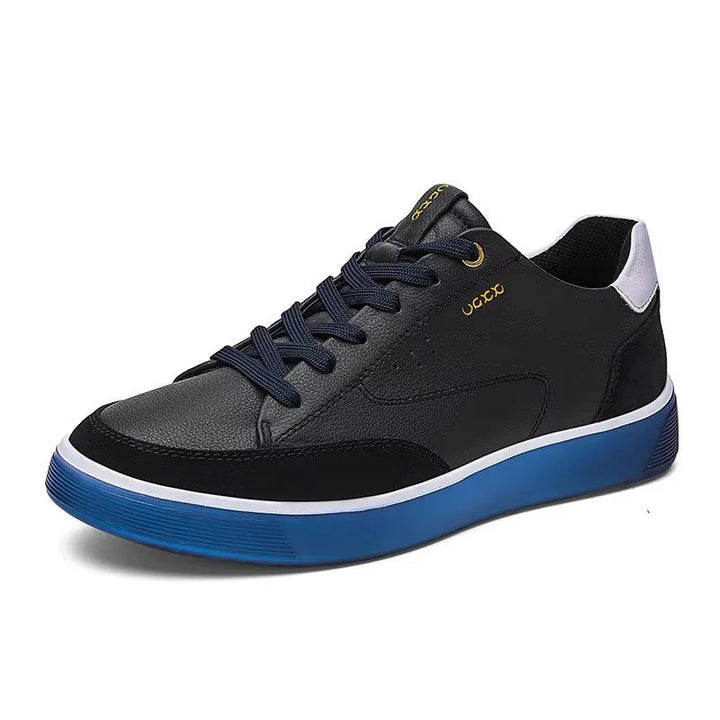 Black and gray sneaker with blue sole on a white background, featuring a British flag and year 1978.