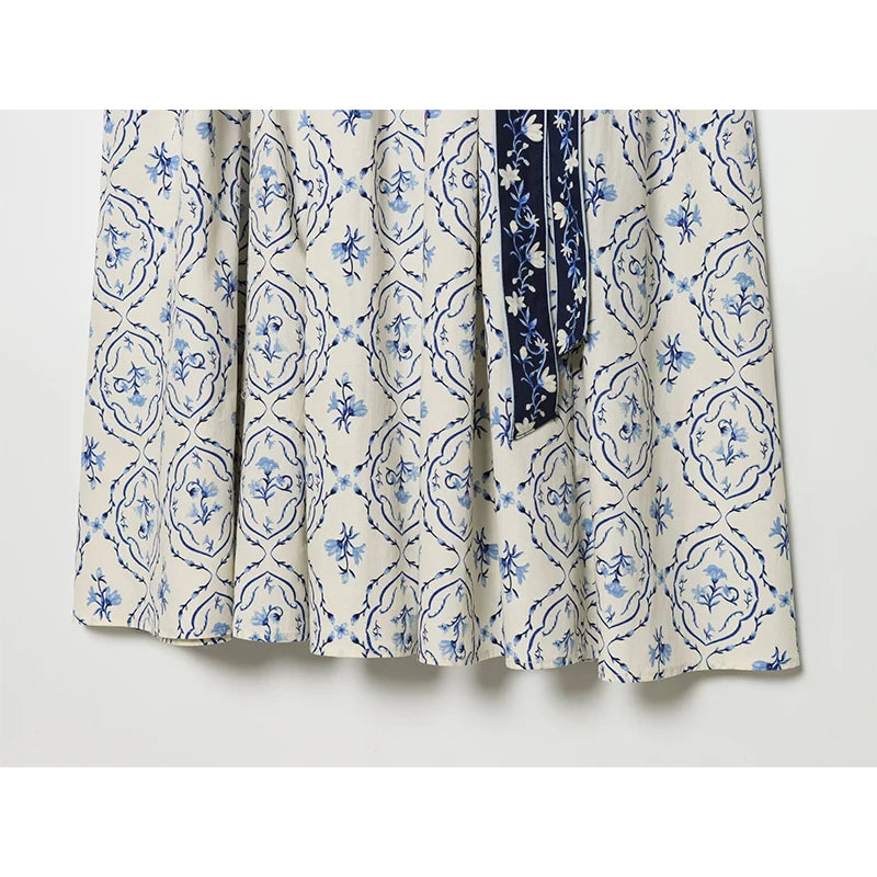 Floral print skirt section with sash tie, white with blue ornate floral pattern