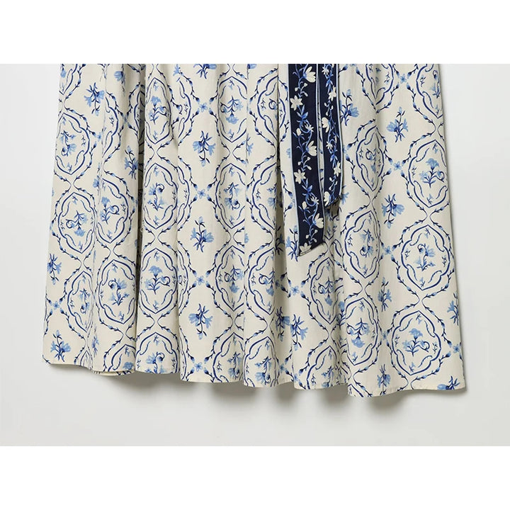 Floral print skirt section with sash tie, white with blue ornate floral pattern