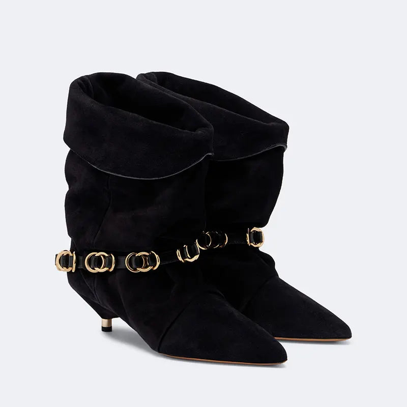 Black suede mid-calf heeled boots with draped cuff and gold-tone chain belt