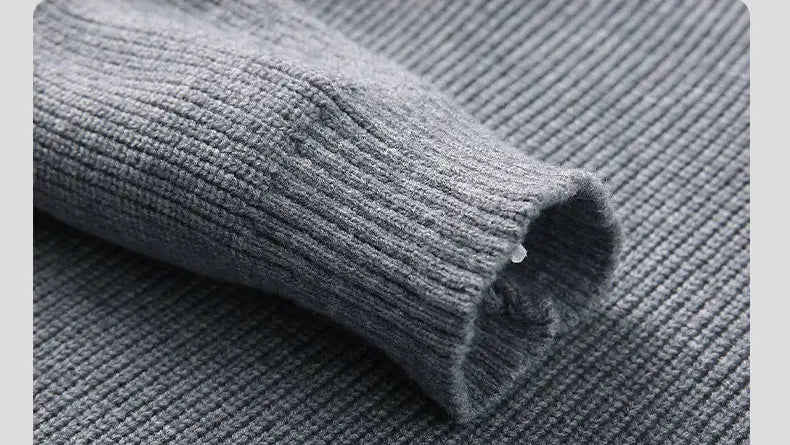 Gray knit sweater sleeve and shoulder texture, ribbed knit finish
