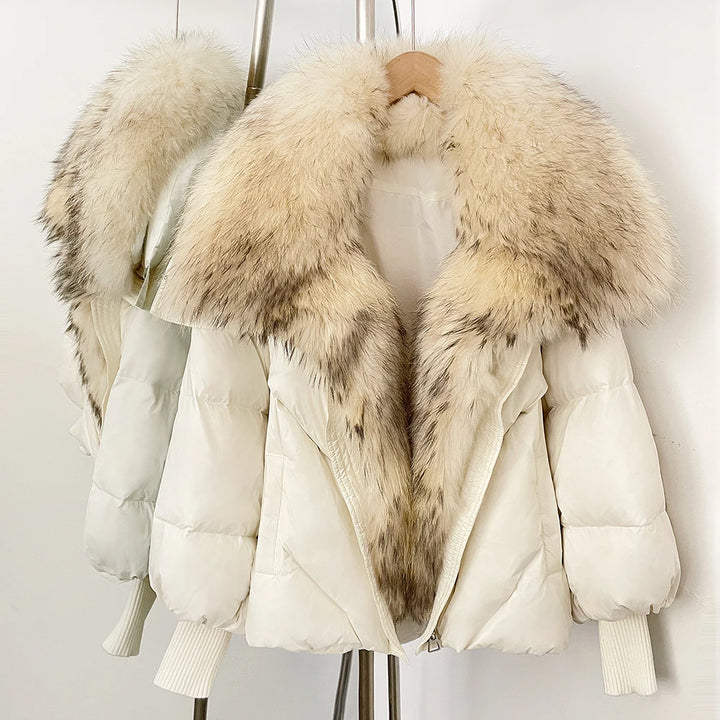 Cream puffer coat with light faux-fur hood trim and long fur front panel