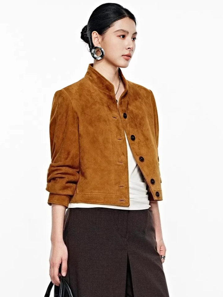 Brown suede cropped jacket, front snap placket, stand collar; side view.