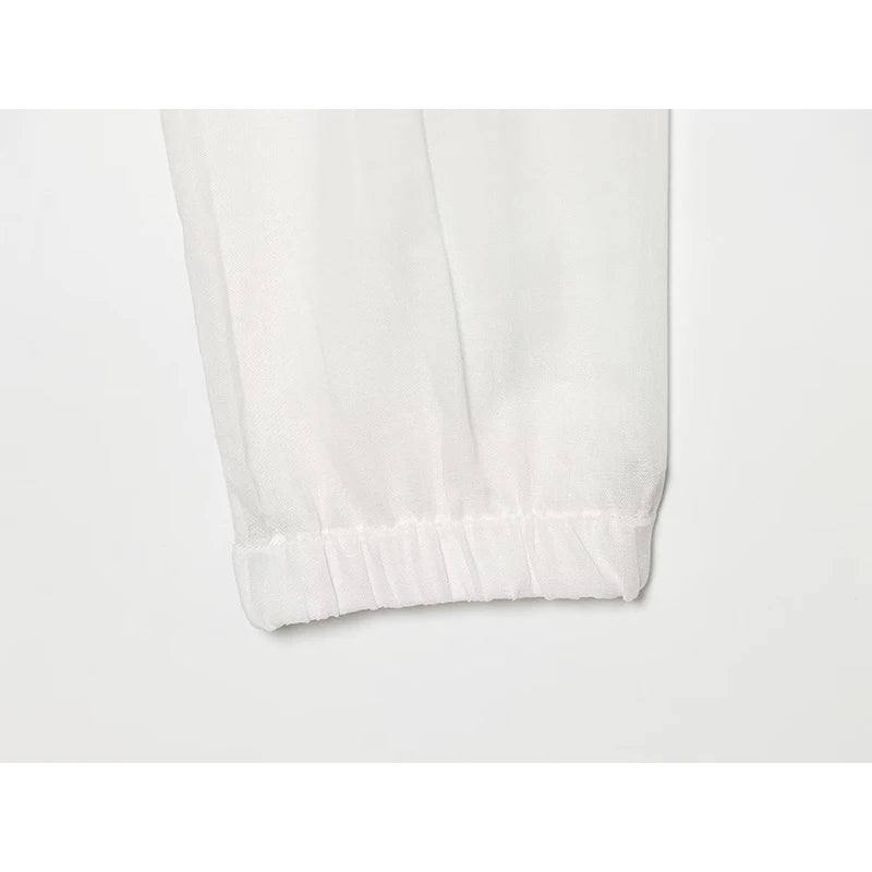 White jacket sleeve cuff with elastic hem and smooth fabric finish