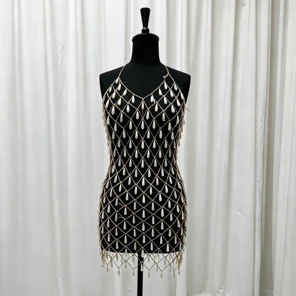 Black sleeveless maternity dress with gold lattice beadwork and scalloped tassel fringe