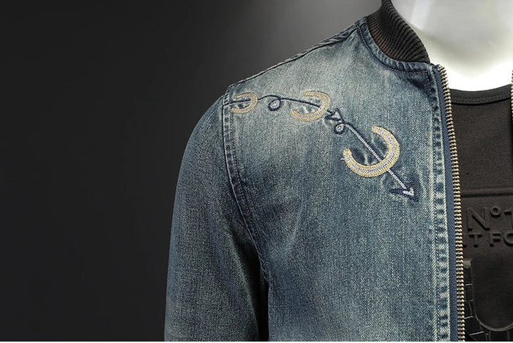 Vintage blue embroidered denim men’s jacket chest detail with front zipper and stand collar