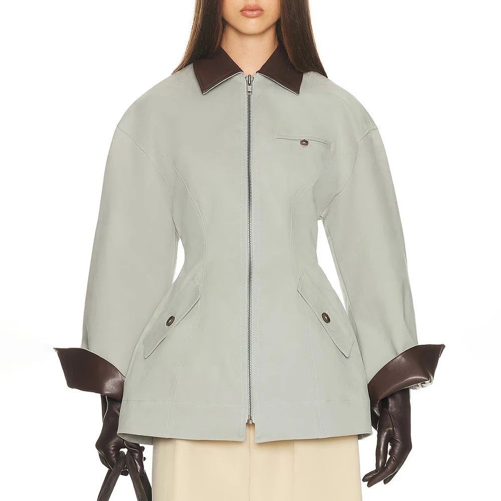Women’s zip-front jacket, light green with brown collar, flap pockets, and 3/4 sleeves