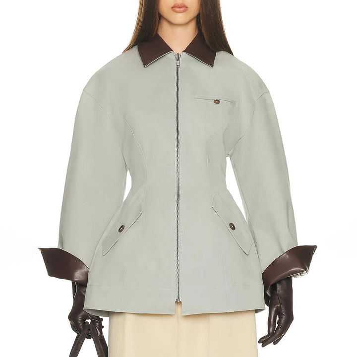 Women’s zip-front jacket, light green with brown collar, flap pockets, and 3/4 sleeves