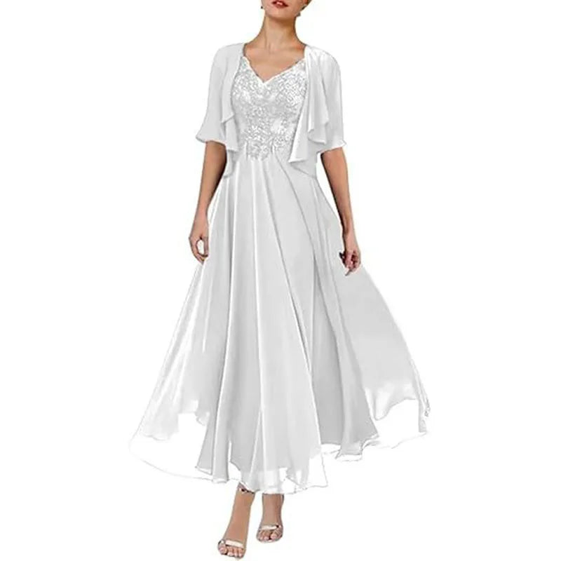 White tea-length chiffon gown with embroidered V-neck bodice