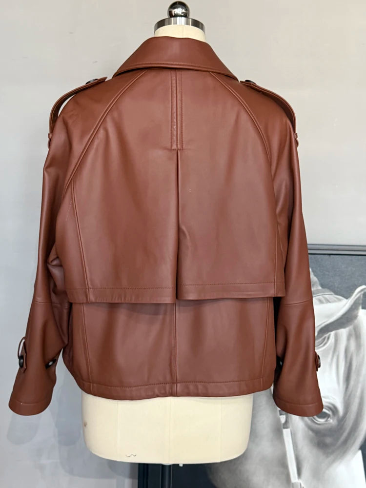 Women’s short leather coat back view with center seam and shoulder yoke, caramel-brown