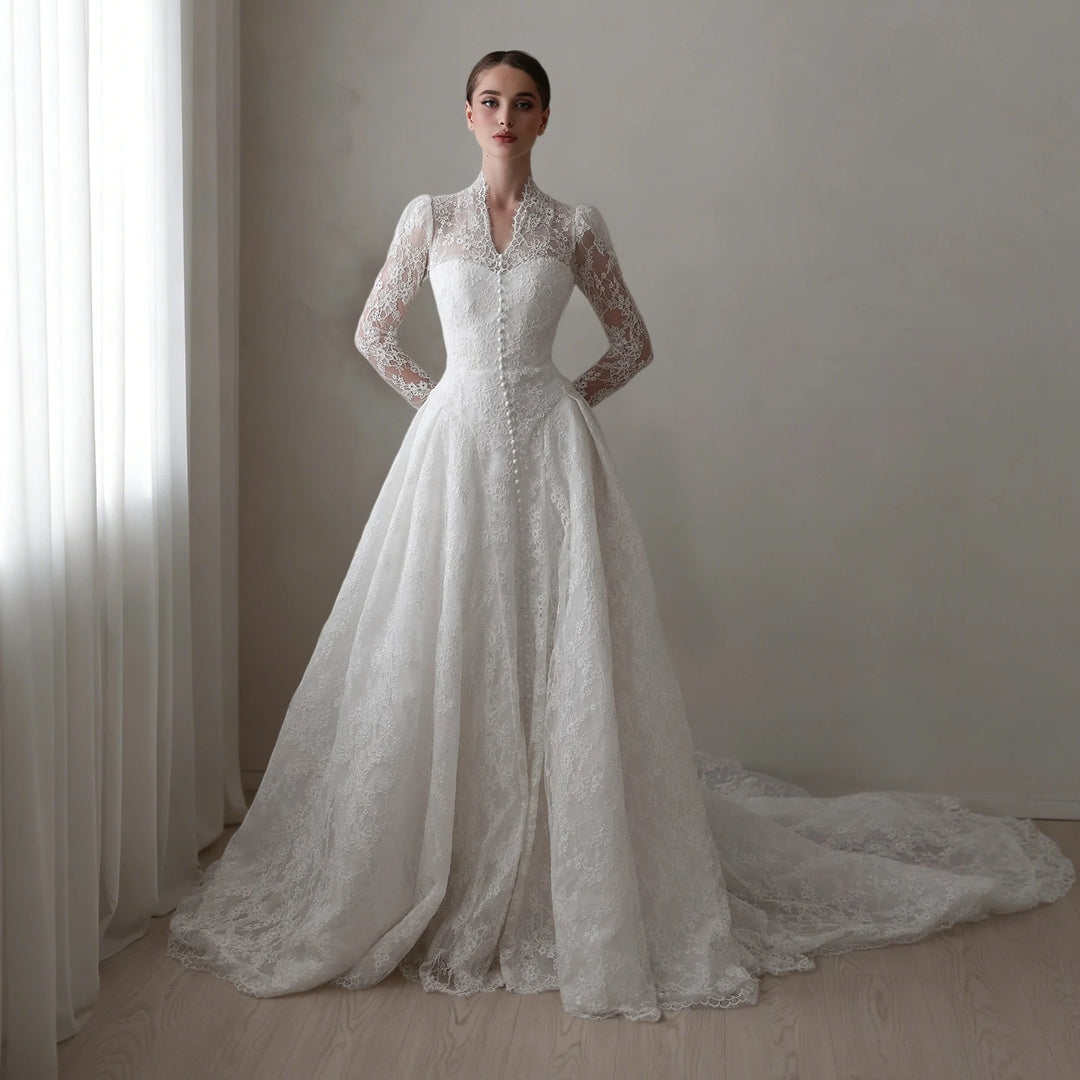 White lace A-line bridal gown with long sleeves and textured bodice