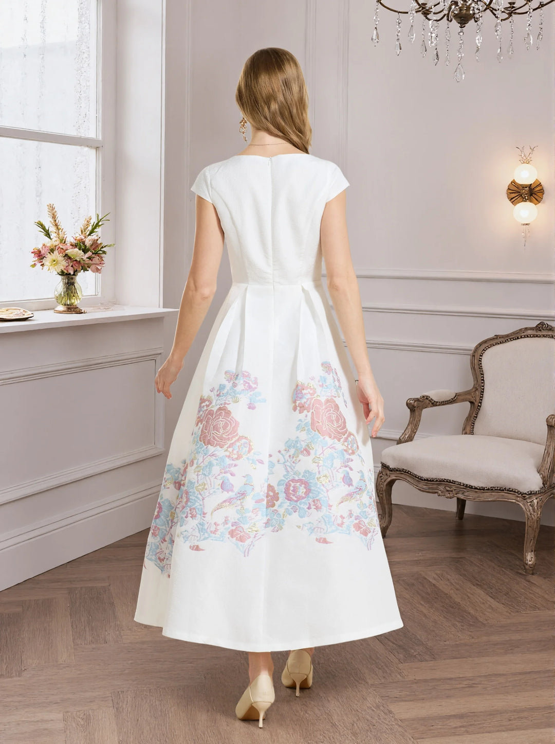 White A-line prom dress back view with pastel floral hem and short sleeves