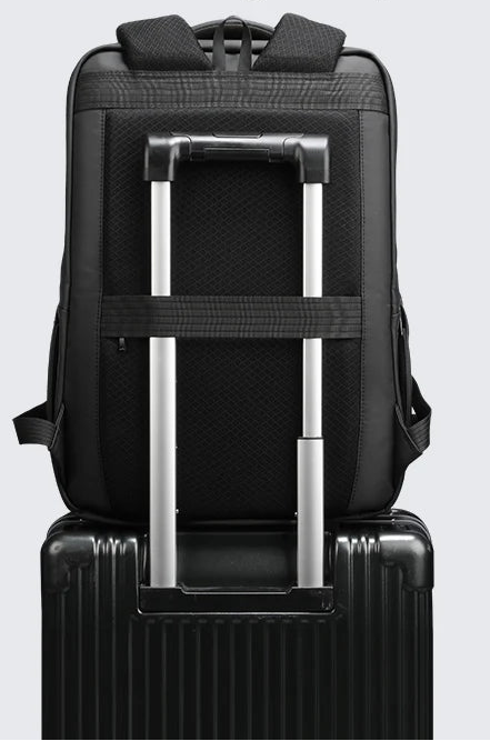 Black backpack with luggage strap and breathable back panel, reinforced handle