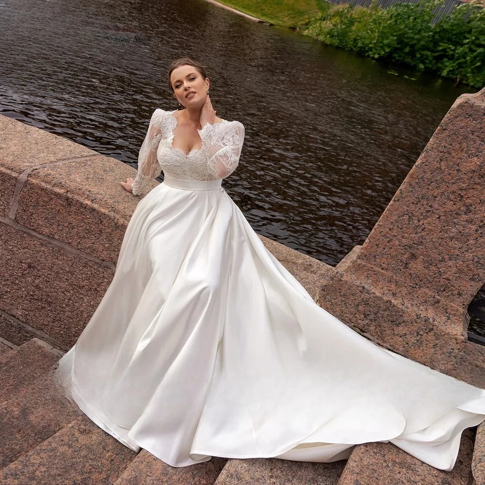 White A-line satin bridal dress with lace bodice, V-neck and full skirt