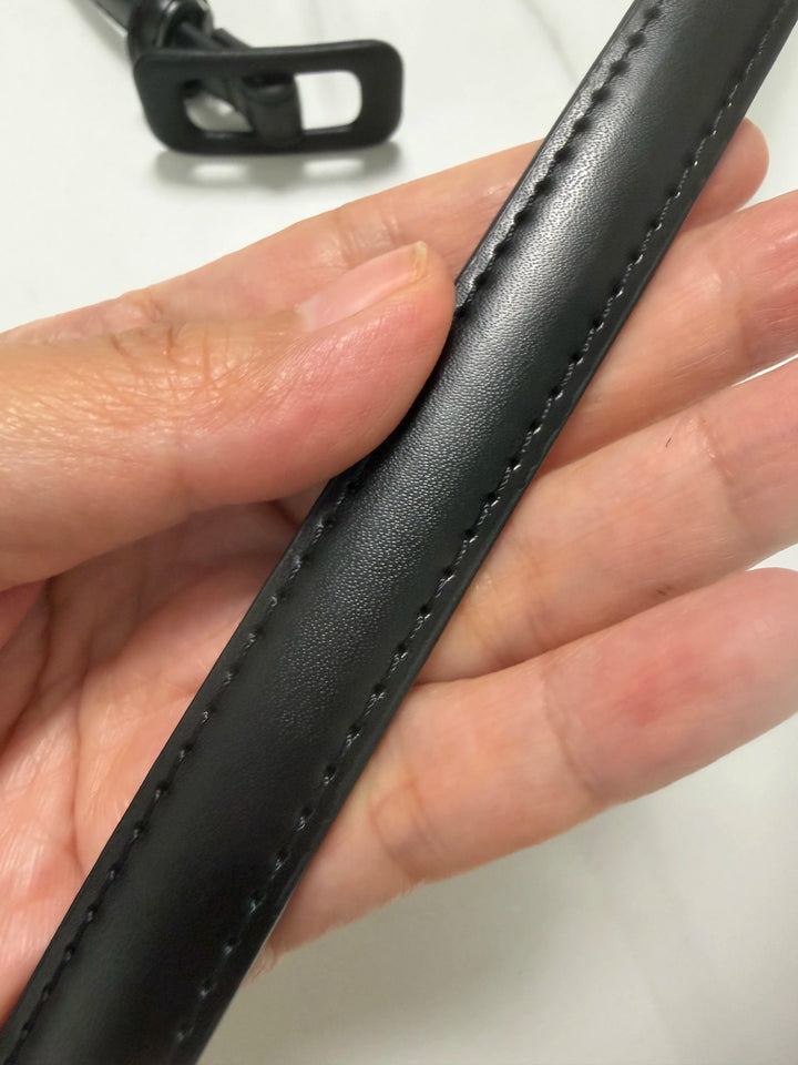 Black leather belt strap with edge stitching and smooth surface