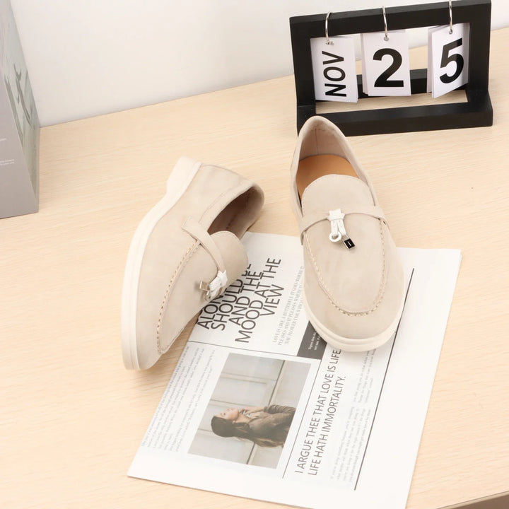 Beige suede slip-on loafers with metal bit detail and white rubber sole