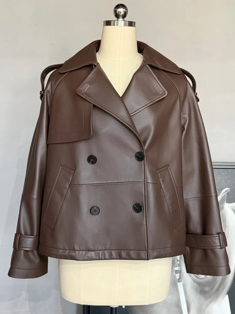 Women’s short leather coat front view with wide lapel, dark-brown buttons and pockets