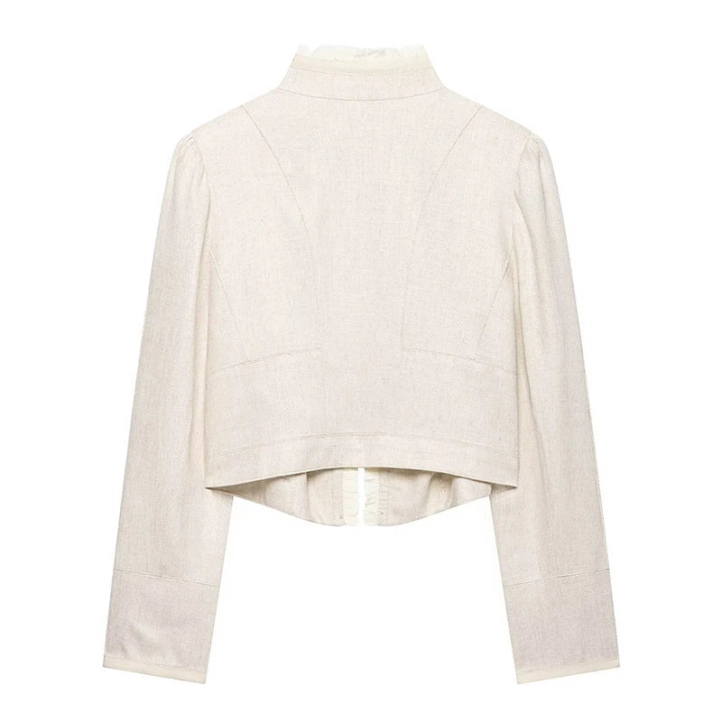 Beige cropped blazer back view with long sleeves and subtle seam panels