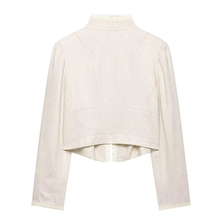 Beige cropped blazer back view with long sleeves and subtle seam panels