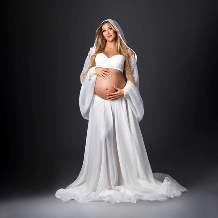 Women’s white maternity robe dress with wide sleeves, veil hood, and full skirt