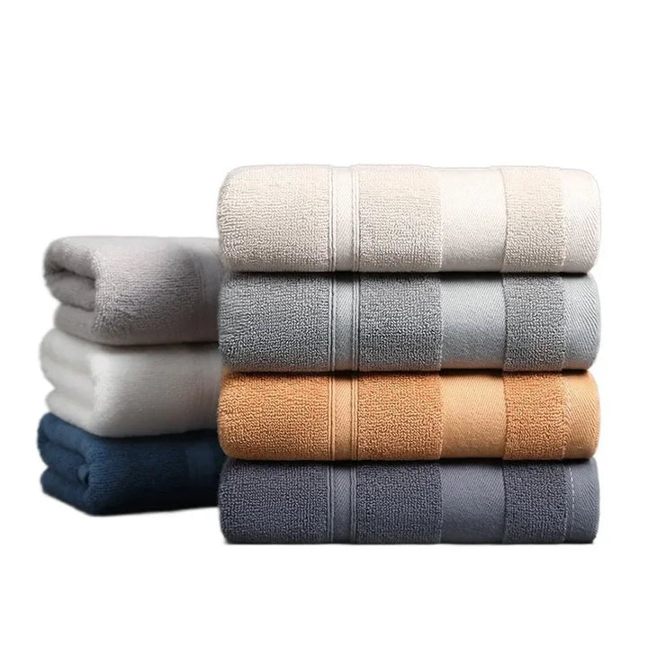 Cotton towel set with stitched bands, beige, light gray, and dark gray stacked