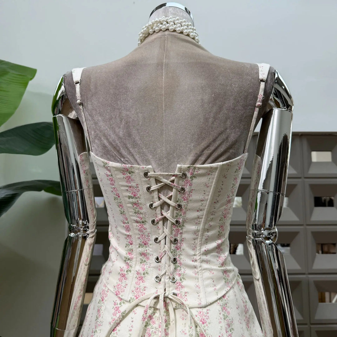 Back view of pink floral print mini skirt set with lace-up corset lacing