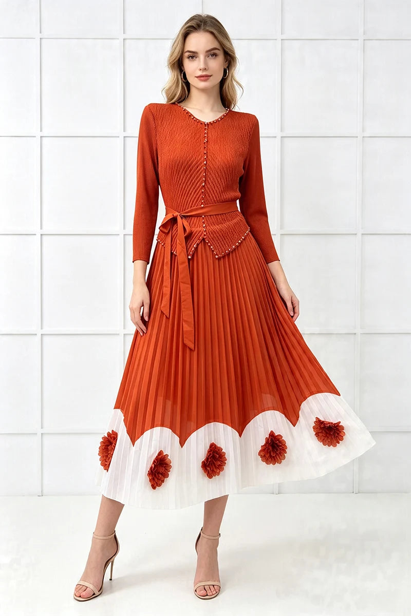 Orange pleated midi dress with button-front detailing and white scalloped hem pom trim